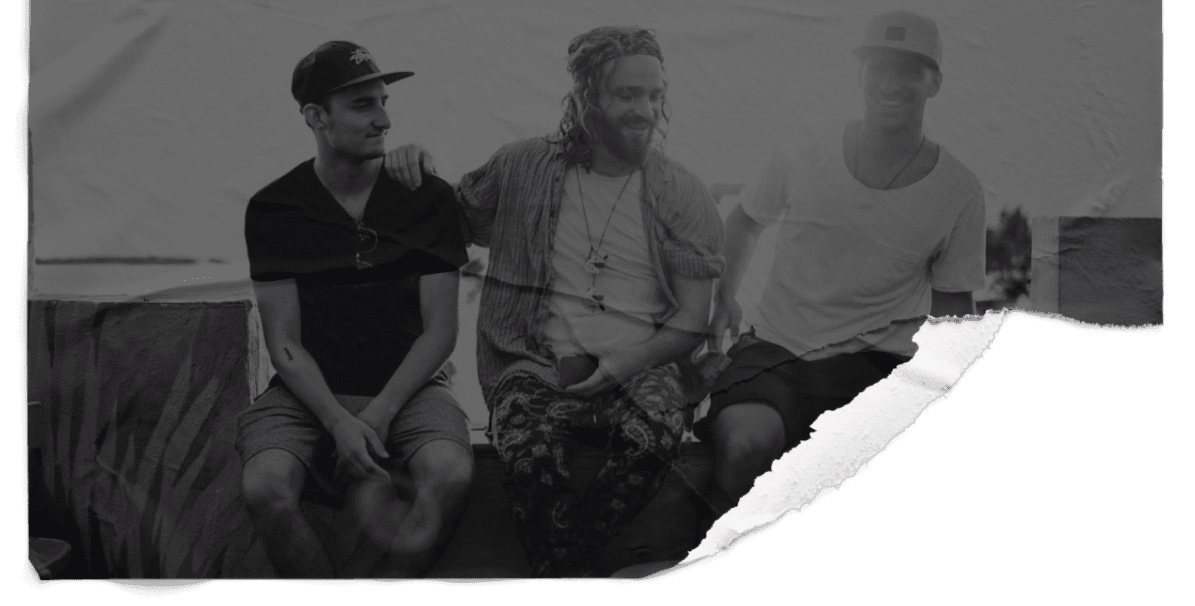 Guys sitting on a wall